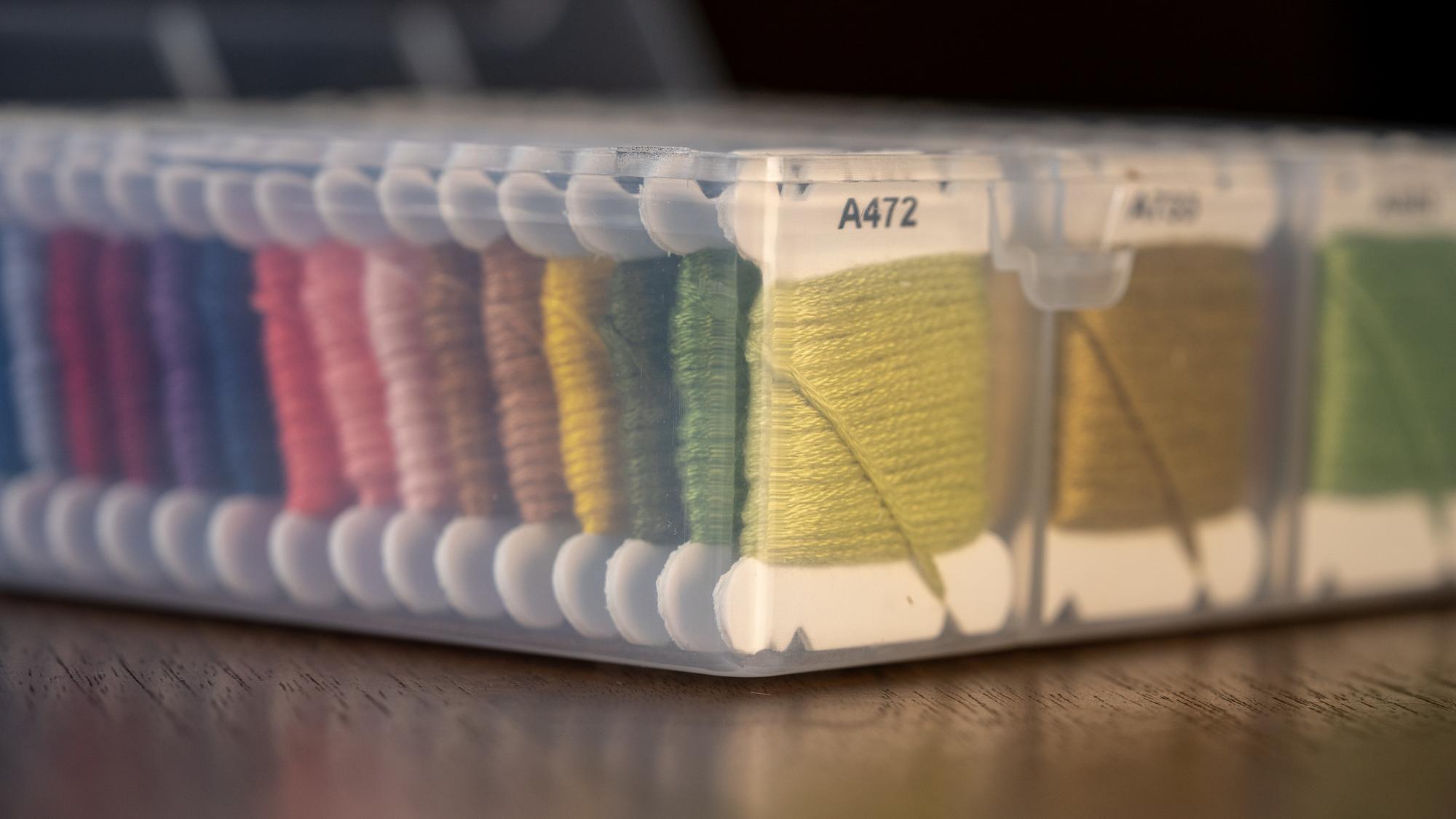 Thread spools and embroidered sample cards